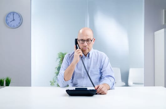 unhappy man because of an unsatisfactory answer by an help desk or a customer or a coworker