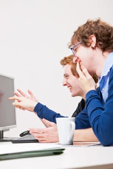 copyspace ready screen and two workers smiling at it