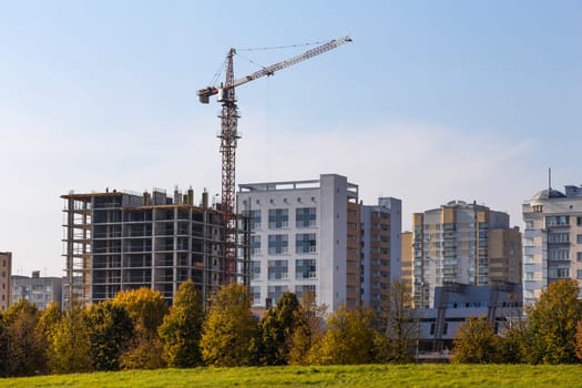 Building crane on construction of city