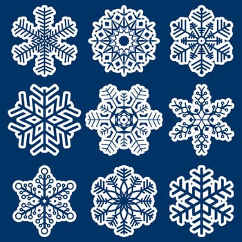 collection of different white snowflakes on blue background