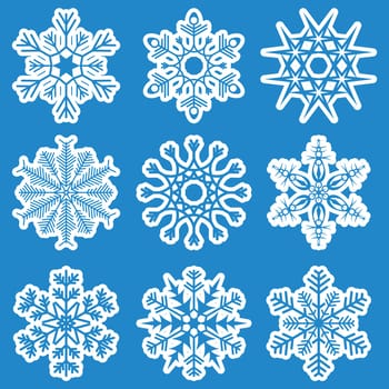 collection of different white snowflakes on blue background