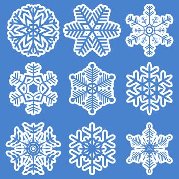 collection of different white snowflakes on blue background
