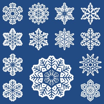 collection of different white snowflakes on blue background