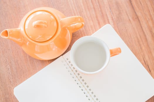 Top view of note book and hot drink, stock photo