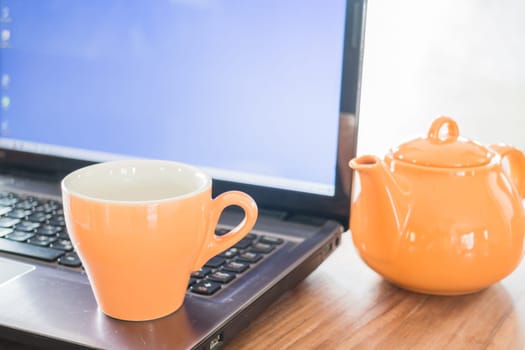 Tea time break on work table, stock photo