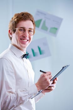 a redheaded accountant with glasses sayin that accounting means funny numbers always squaring