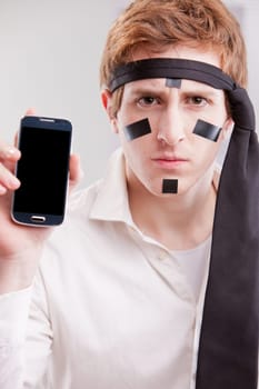 a young male warrior of the office wielding a mobile phone