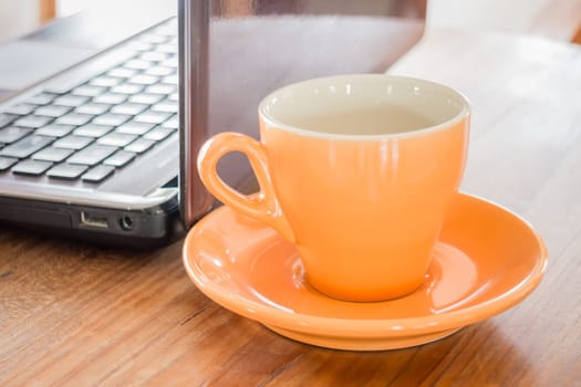 Hot cup of tea on work table, stock photo