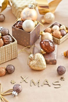 Colorful Christmas tree balls in small gift boxes with pattern