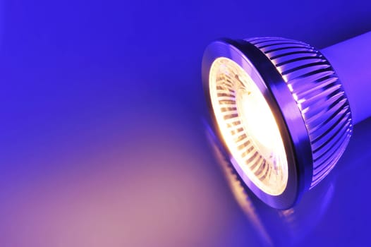 Macrodetail of a warm white COB LED in blue-violet light