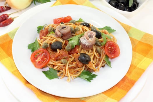 Capellini with tomatoes,anchovies,capers and olives