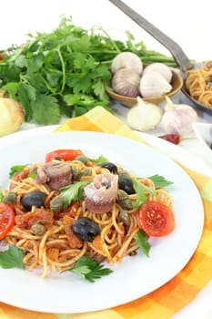 Capellini with tomatoes,anchovies,capers and olives