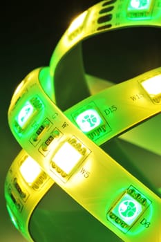 Macrodetail of an RGB LED strip combined with warm white LEDs in colored light