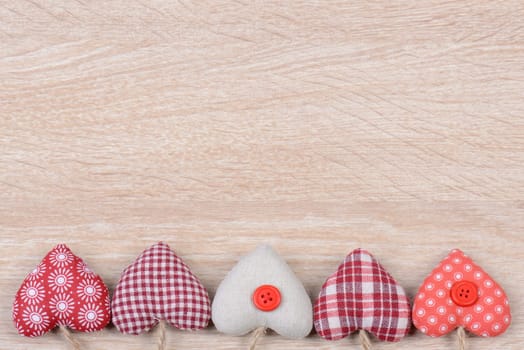 Hearts on wood background