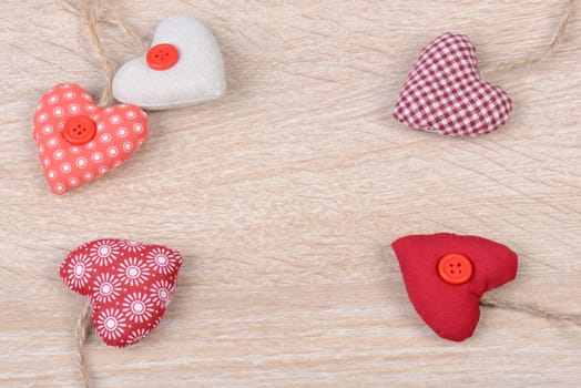 Hearts on wood background