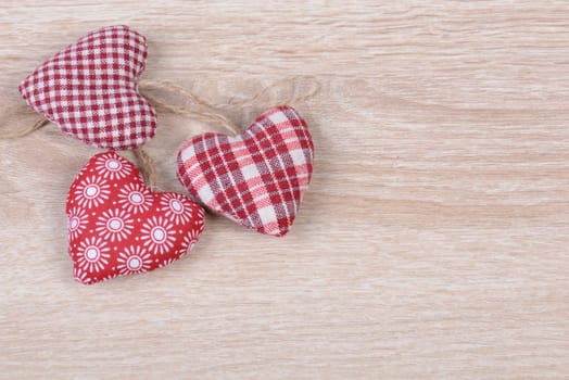 Hearts on wood background