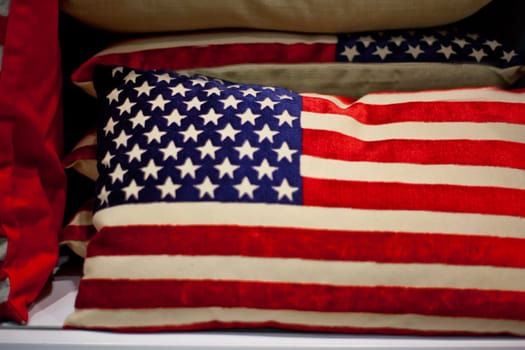 American flag cushion on sale. Selective focus
