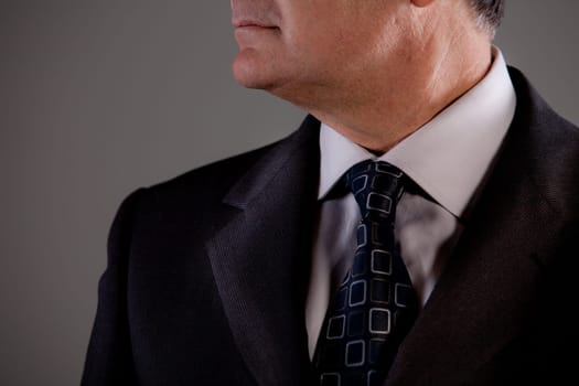 neck and a part of the face of an old man looking at his side