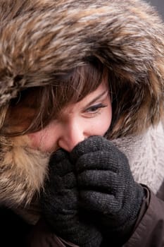 A pretty natural smiling girl in winter clothes