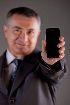 A senior manager using successfully his inseparable smartphone agenda and calendar