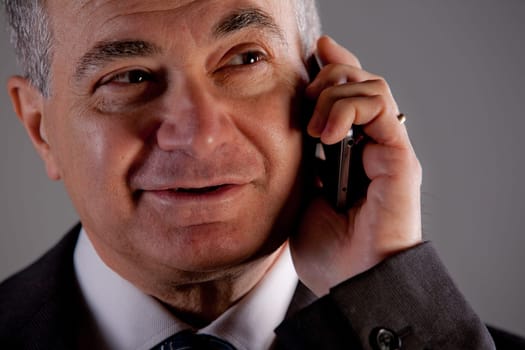 A senior manager using successfully his inseparable smartphone agenda and calendar