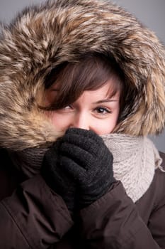 A pretty natural smiling girl in winter clothes