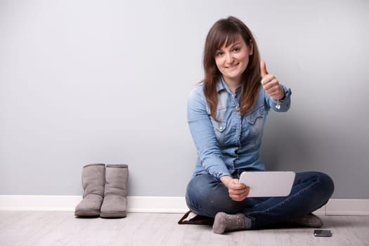 ordinary successful girl showing off fingers of victory