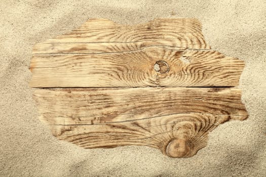 sand frame on planked wood. summer concept with copy space. top view