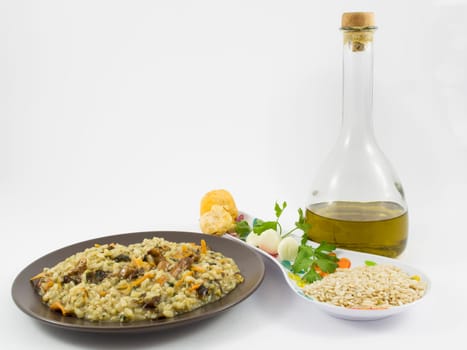 A plate of "risotto"" with mushrooms and its ingredients on white background"