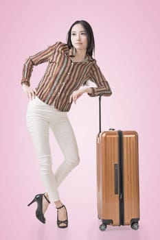 Modern Asian woman stand with a luggage.
