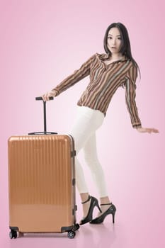 Modern Asian woman stand with a luggage.
