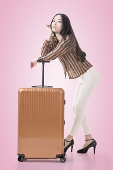 Modern Asian woman stand with a luggage.