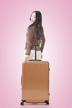 Modern Asian woman stand with a luggage.