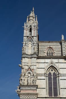 The gothic Cathedral of Siena (Tuscany, Italy). View from east side. Vertically.
