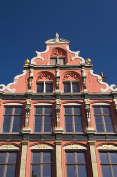Gable roof and windows of the historic house (Bruges, Belgium). Front view.