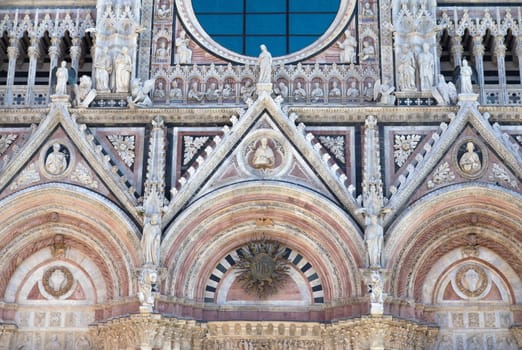 Closeup view of the entrance portal of the Cathedral l of Siena (Tuscany, Italy)