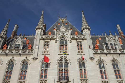 Front view of The Provinciaal Hof (Province Court) is a Neogothical building on the market place in Bruges (Belgium)