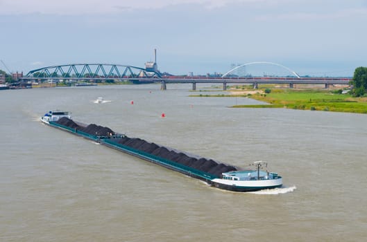 coal barge on the Waal river at Nijmegen, netherlands