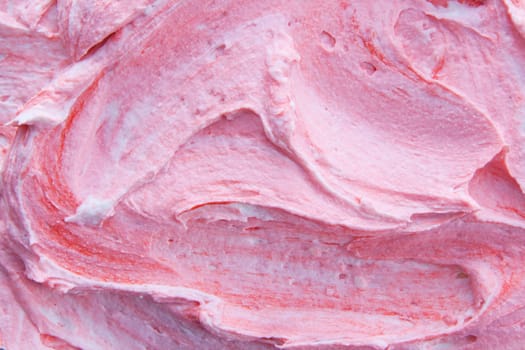Background texture and pattern of swirled pink berry frozen yogurt for a delicious refreshing summer dessert or sweet