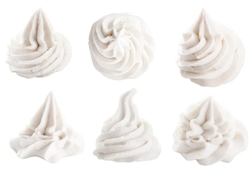 Set of six different white decorative swirling toppings for dessert isolated on white depicting whipped cream, ice cream or frozen yogurt