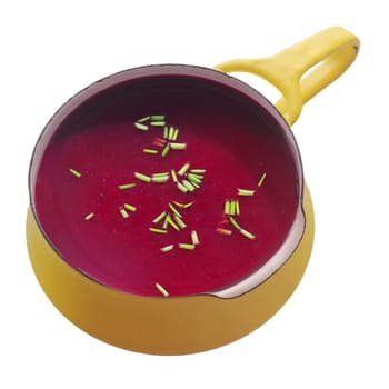 Close up Healthy Hot Beetroot Soup in the Yellow Pot. Isolated on White Background.