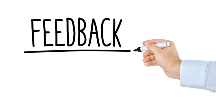 Hand with pen writes feedback