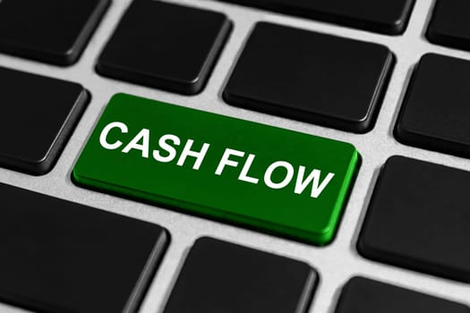 financial cash flow green button on keyboard, business concept