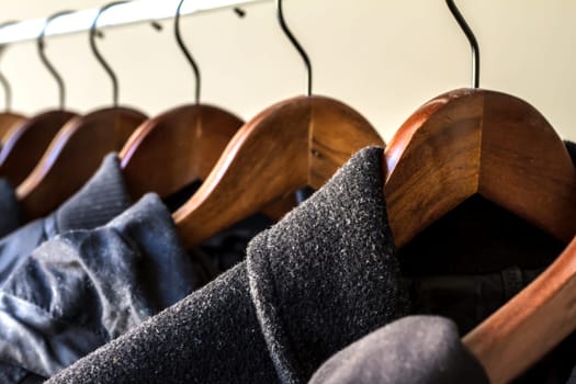 Winter clothes hanged on a clothes rack.