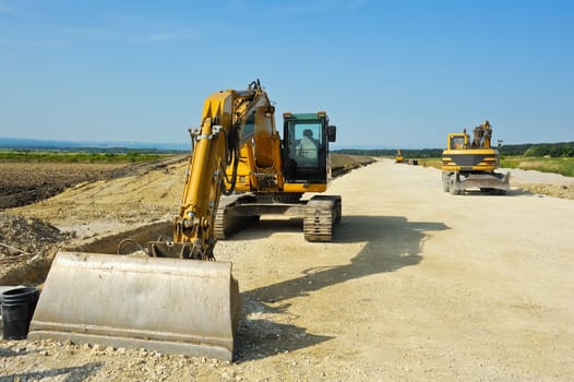 Excavators in road construction
