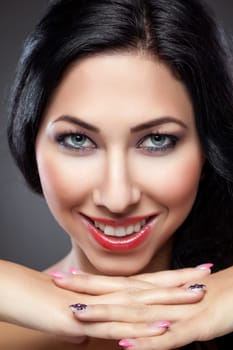 Young beautiful woman with perfect skin and nails