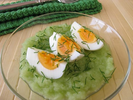 Eggs on cucumber puree with dill