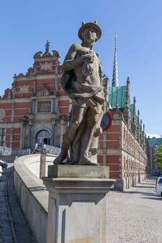 Hermes figure with purse in front of the Copenhagen Stock Exchange