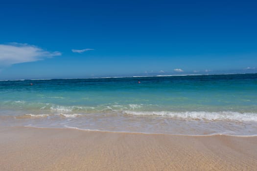 Beautiful secluded sandy beach in the Caribbean with white sand and blue sky as in paradise