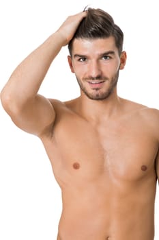 attractive muscular young man with free torso and beard isolated against white background